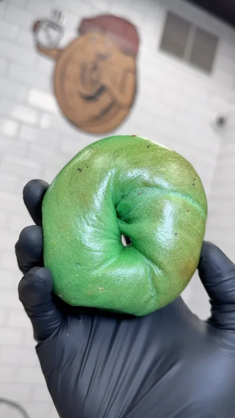 A green St. Patrick’s Day bagel